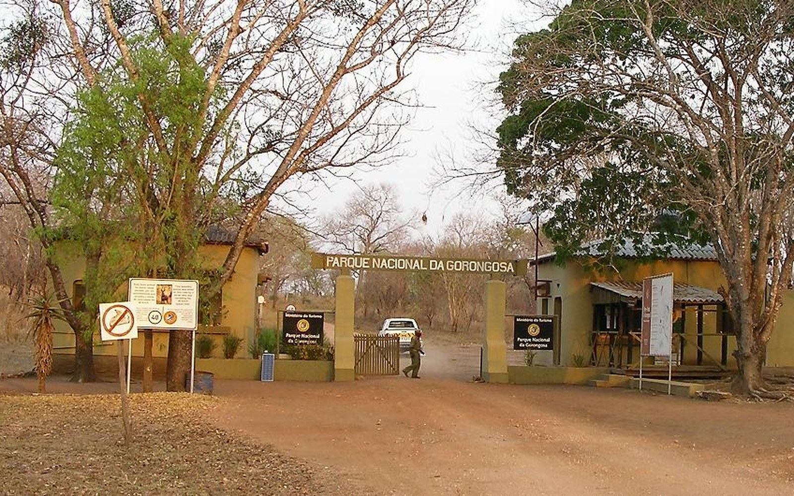 The entrance gate to Parque Nacional da Gorongosa under bare trees