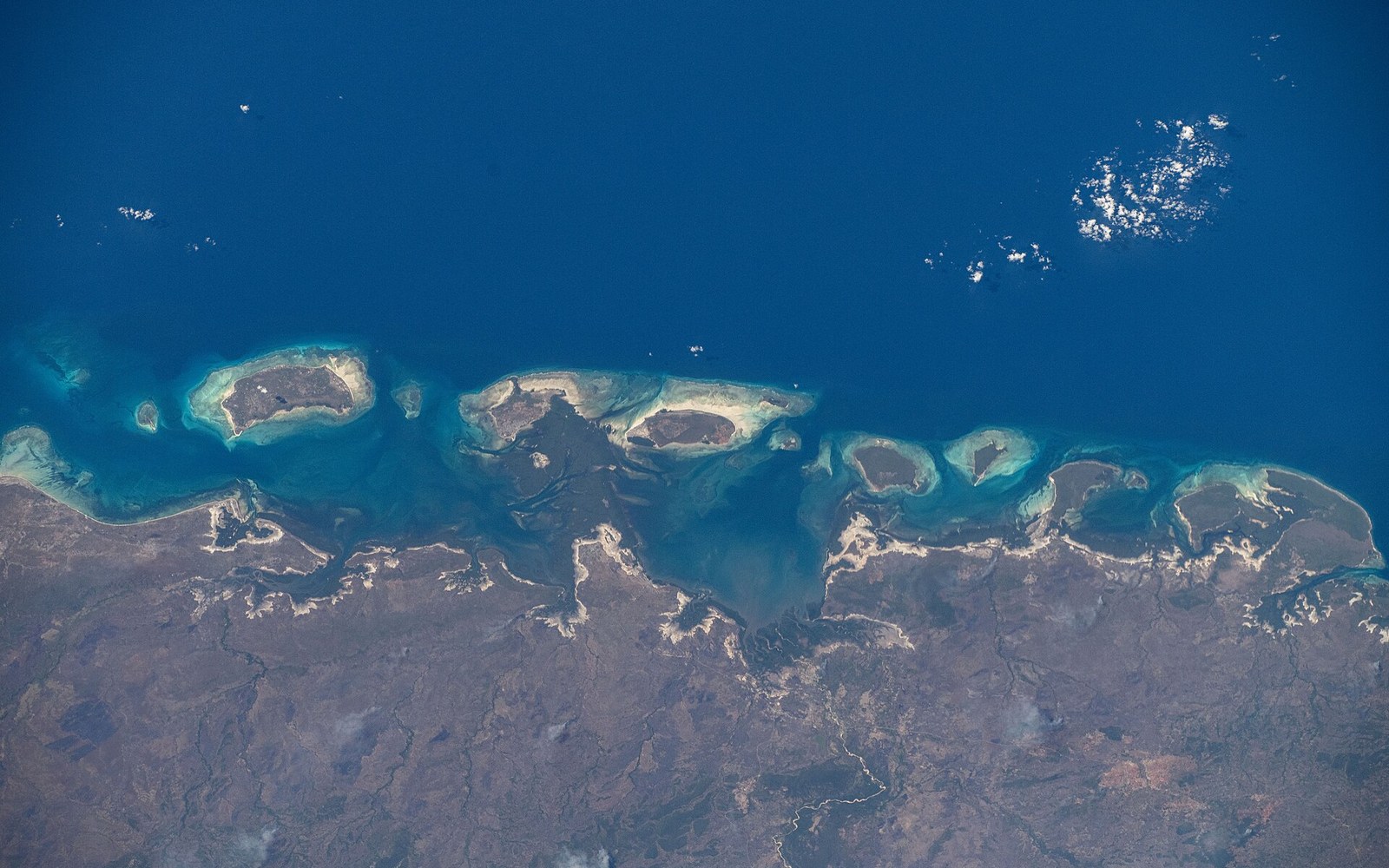 The Quirimbas chain from orbit: coral islands and reef edges along the coast